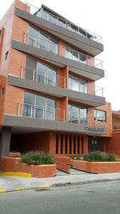 Edificio "Bajos del Rio" -- our rental apt on "segundo piso" has a view of Yanuncay River Park but no balcony
